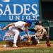 Boulders second baseman Tucker Nathans tags out a baserunner during a game on June 4, 2023. (Photo credit: Drew Wohl)