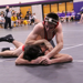 Senior Cole Munsterteiger controls his Scott West opponent on his way to a second period pin.