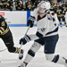Penn State sophomore forward Tessa Janecke shoots the puck in her Penn State white and navy uniform.