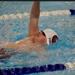 boys swimmer doing backstroke