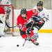 Fox’s Scott McRoy stickhandles the puck in front of Northwest captain Jake Schlereth in Saturday night’s Mid-States Club Hockey Association game at the Webster Groves Ice Rink.  Ron Rigdon photo