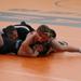 Ninth grader Mason Merritt looks for a pin over his GSL/LP opponent
