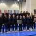 gymnastics team with section championship trophy