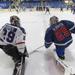 The Team Blue and Team White goalies talk during warmups of the BioSteel All-American Game.