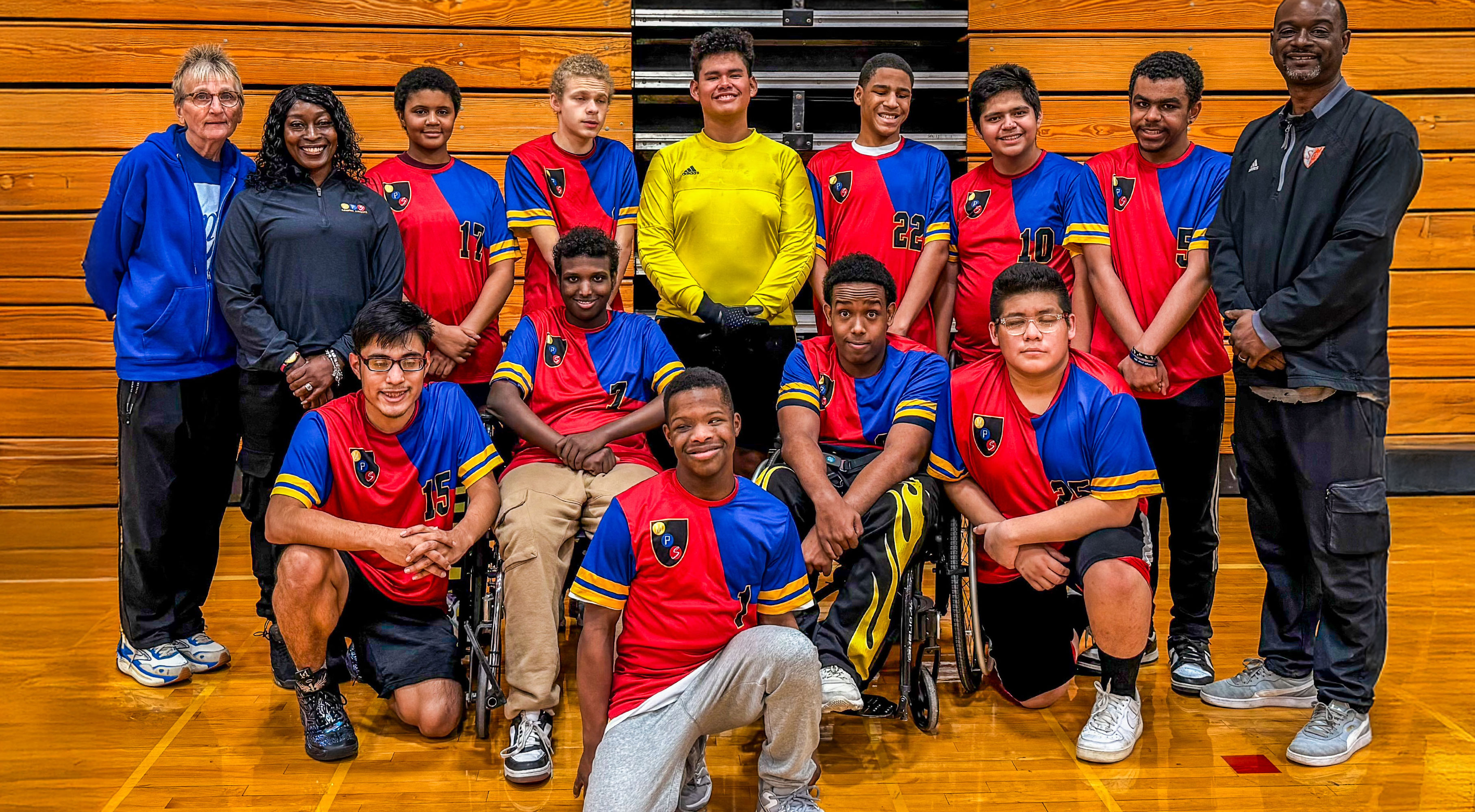 Image: Mpls Adapted Soccer players pose together for a team photo at Jack Wells Auditorium