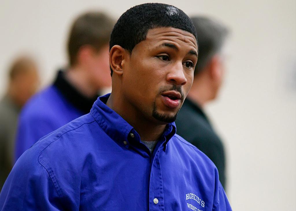 Minneapolis Roosevelt High School wrestling alumn Marcus LeVesseur as a wrestling coach at Hopkins High School