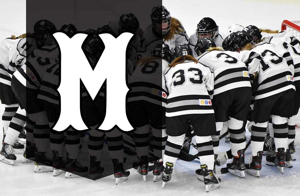Image of Minneapolis Girls High School Hockey players huddle up on the ice. Superimposed over the image is the signature “M” logo for Minneapolis Hockey. 