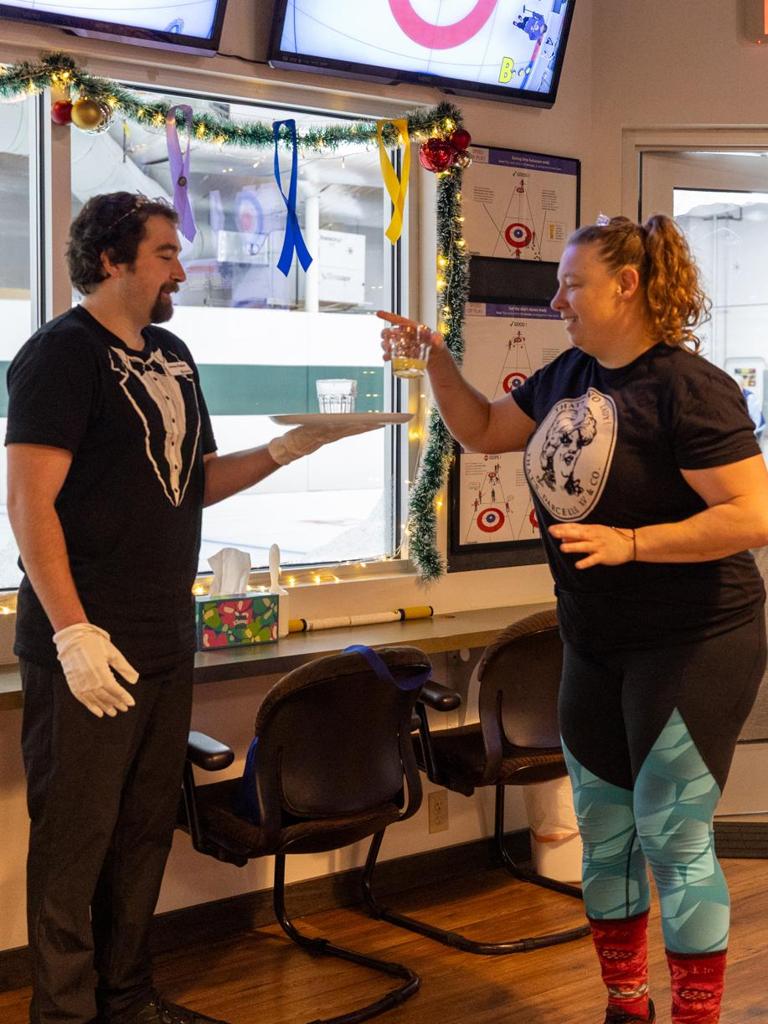 Liquor lap butler delivers a drink