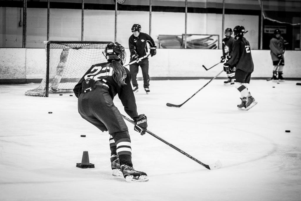 Teen learning to play hockey