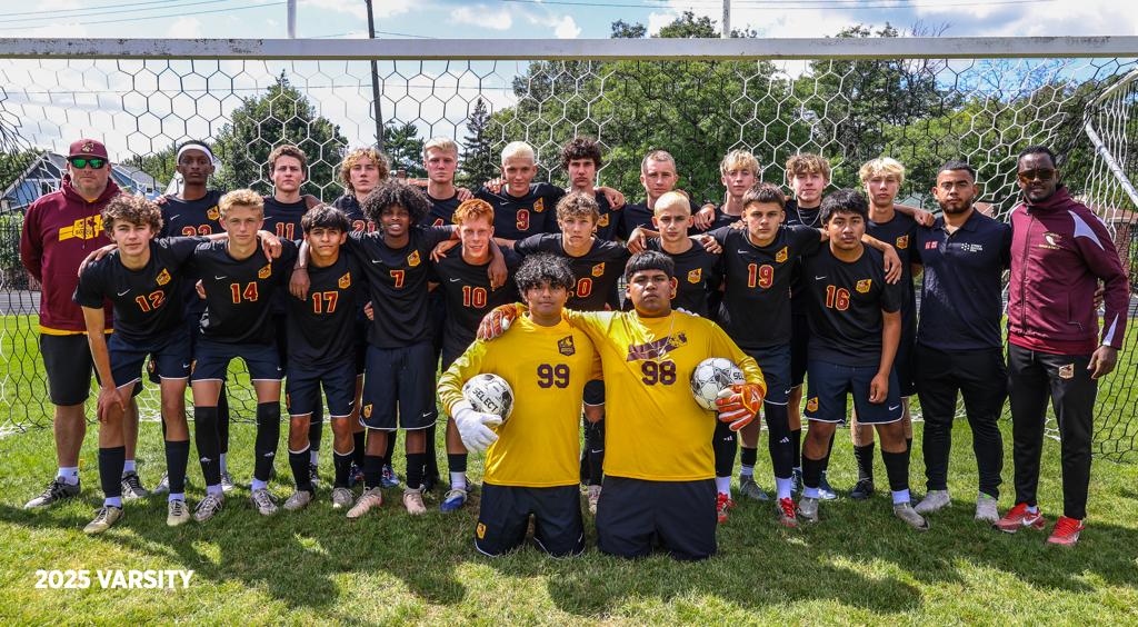 Image of Minneapolis Roosevelt High School’s boys varsity soccer team of 2025 grouped together with their coach for a team photo on the field at Al Gowans Stadium.