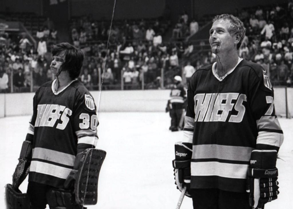 A clip from the movie Slapshot starring Paul Newman. Minneapolis Roosevelt alumn Ron Docken pin a scene in the movie standing on the ice with acting legend Paul Newman