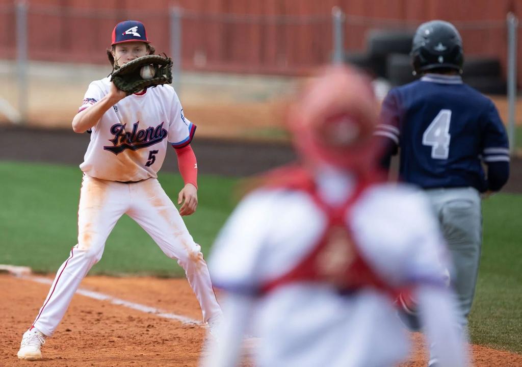   Helena Senators infielder/outfielder James DeMers (#5) catches a putout from his catcher during Game 1 of Saturday's nonconference doubleheader against the Missoula Mavericks at Kindrick Legion Field. SONNY TAPIA, Independent Record 