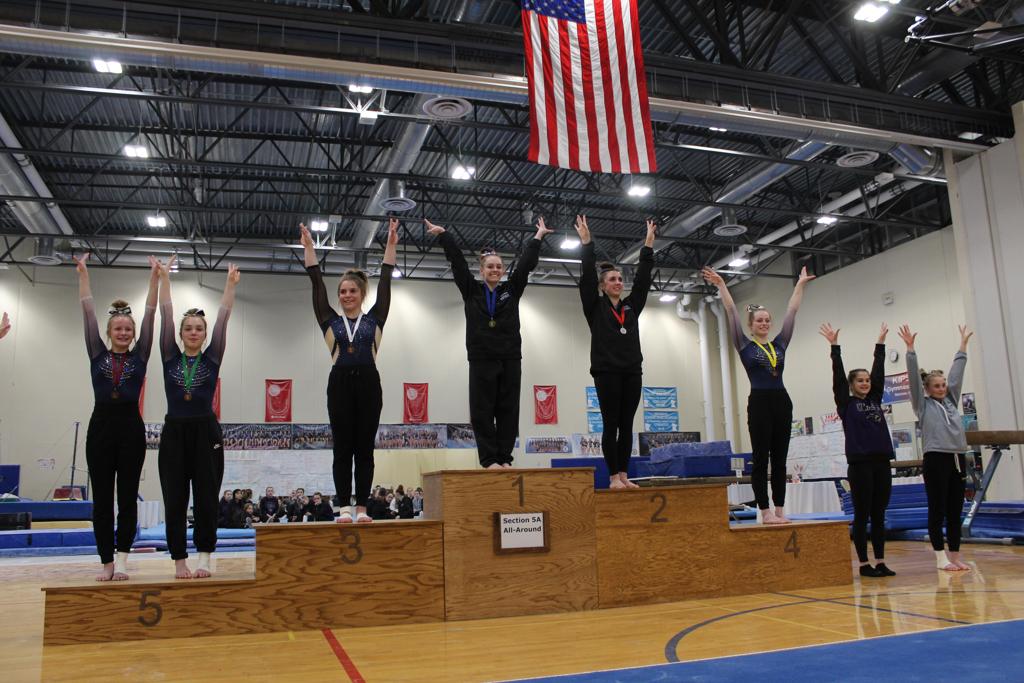Reagan Kelley stands at top of podium