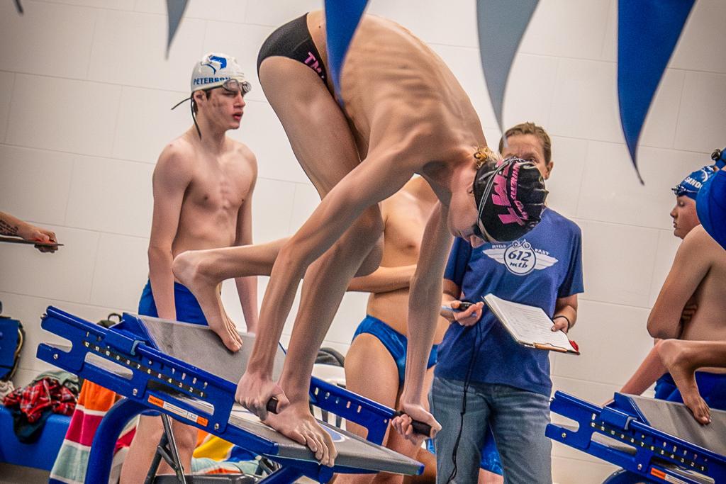 TMT Swimmer on the block ready and waiting for the gun