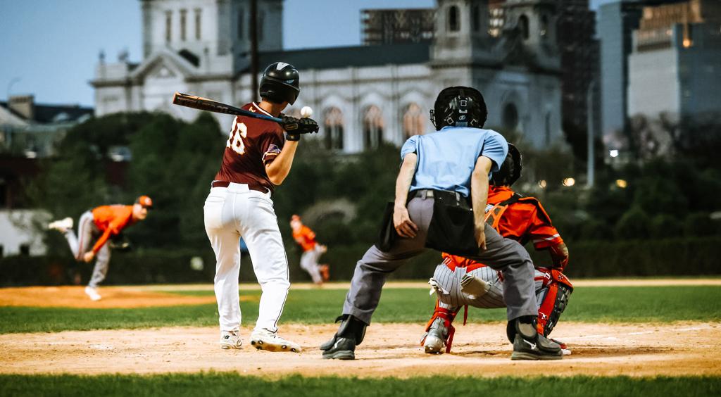 Image of the Minneapolis Roosevelt High School Teddy Baseball hitter making contact with the ball