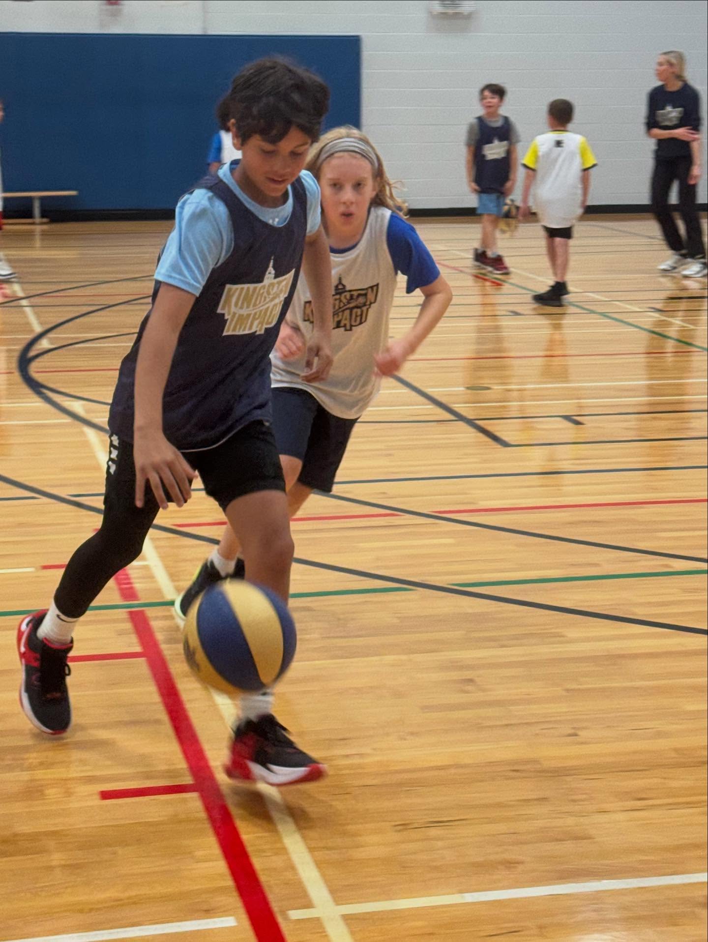 2 players playing basketball